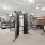 The fitness center at Urba Apartments in Ballston, Arlington, VA, featuring exercise machines and cardio equipment.