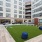 The outdoor lounge at Urba Apartments in Ballston, Arlington, VA, featuring outdoor furniture and lawn games.